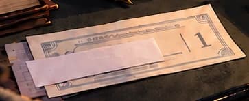 Partly covered payment slip on the desk