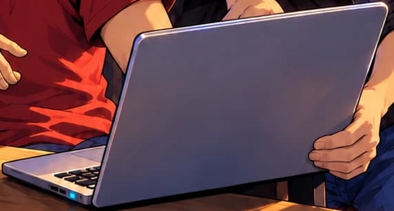 Open laptop with its screen facing the seated man