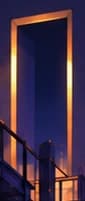 Distant unfinished doorway glowing amber