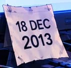 Paper showing 18 DEC 2013 beside the monitor