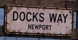 Docks Way / Newport sign on the landfill fence