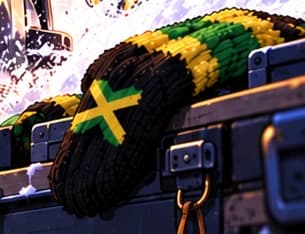 Black, green and yellow mitten on the lower case