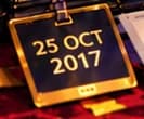 THE DATE TAG. 25 OCT 2017 marks the selected moment. Its placement beside the folder links the theatrical scene to the historical date, without suggesting that this tag existed.