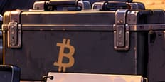 THE BITCOIN CASE. The Bitcoin symbol connects the technician's everyday tools to a cryptocurrency-funded gift. It links an abstract asset to practical work without identifying Pine or a real field team.