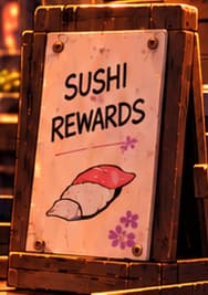 SUSHI REWARDS. The menu points to the token incentives used to attract providers. It depicts the 2020 liquidity-mining offer; no reward rate, token price or guaranteed return is stated.