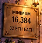 THE MINIMUM THRESHOLD. The sign pairs 16,384 with 32 ETH each: 524,288 ETH in minimum qualifying deposits. MINIMUM matters; this is a launch threshold, not an actual genesis-validator count.