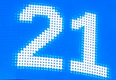 THE TWENTY-ONE COUNTDOWN. The giant 21 recalls the ceremony's 21-second digital countdown. Nasdaq identified it as a reference to Bitcoin's maximum supply of 21 million. It is a countdown clue, not a stock price.