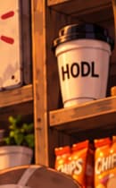 The HODL cup. A HODL-labelled cup rests on the upper-right shelf in the full artwork. Its message recalls crypto culture's instinct to hold through uncertainty. The tighter card crop partly hides this detail; the full-art book page preserves it.
